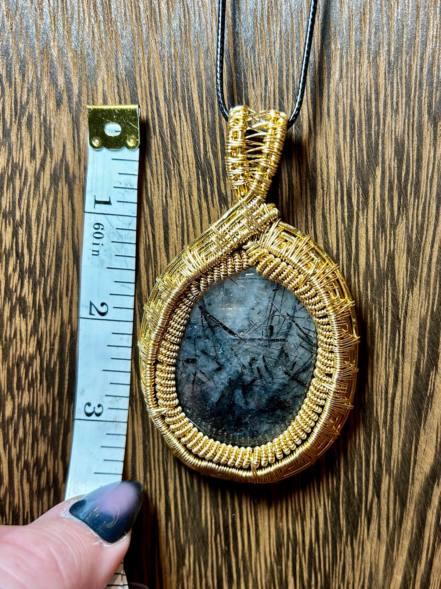 Tourmalated Quartz Wrapped In Gold Colored Wiring