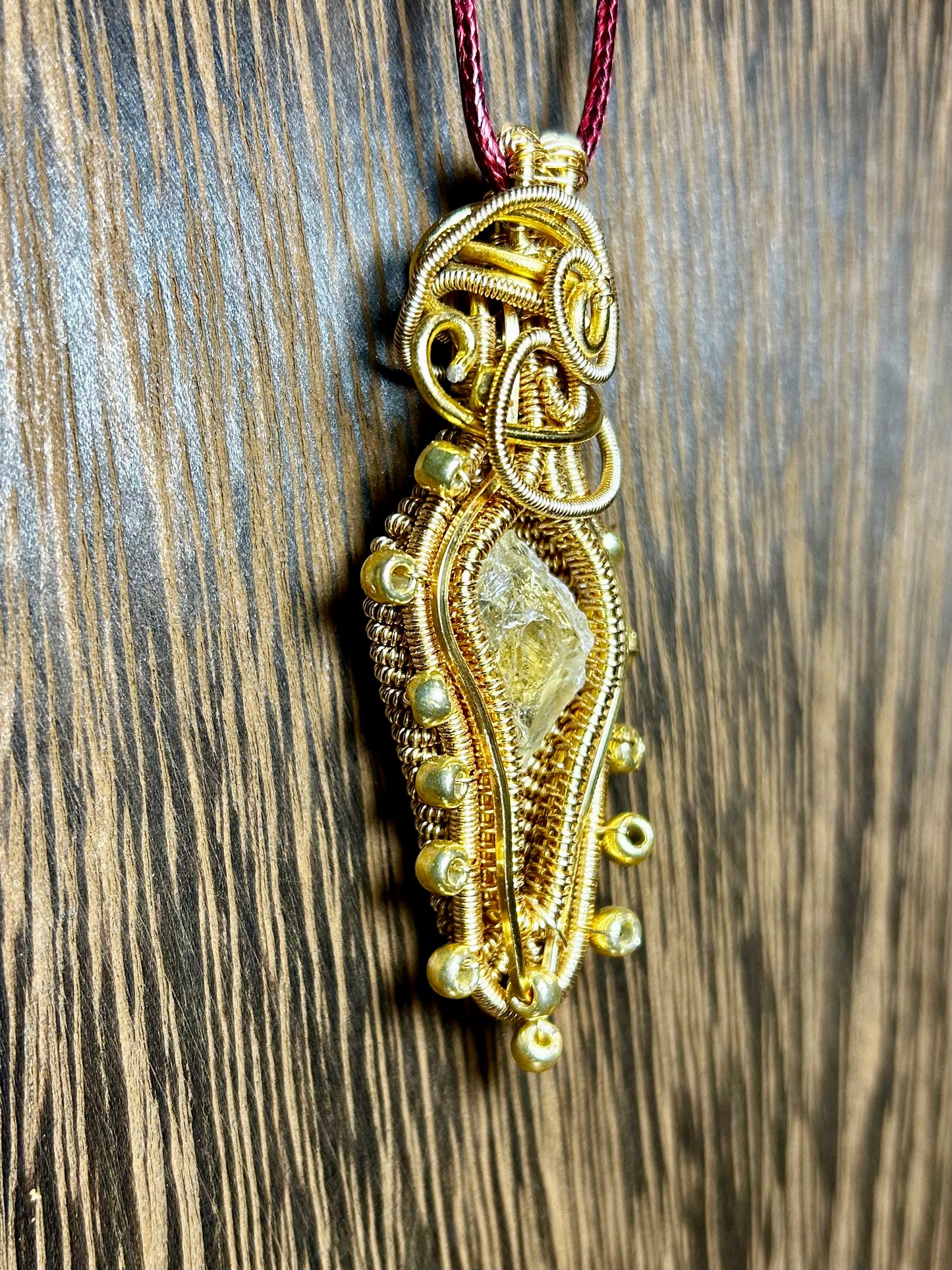 Citrine Wrapped in Gold Colored Wiring