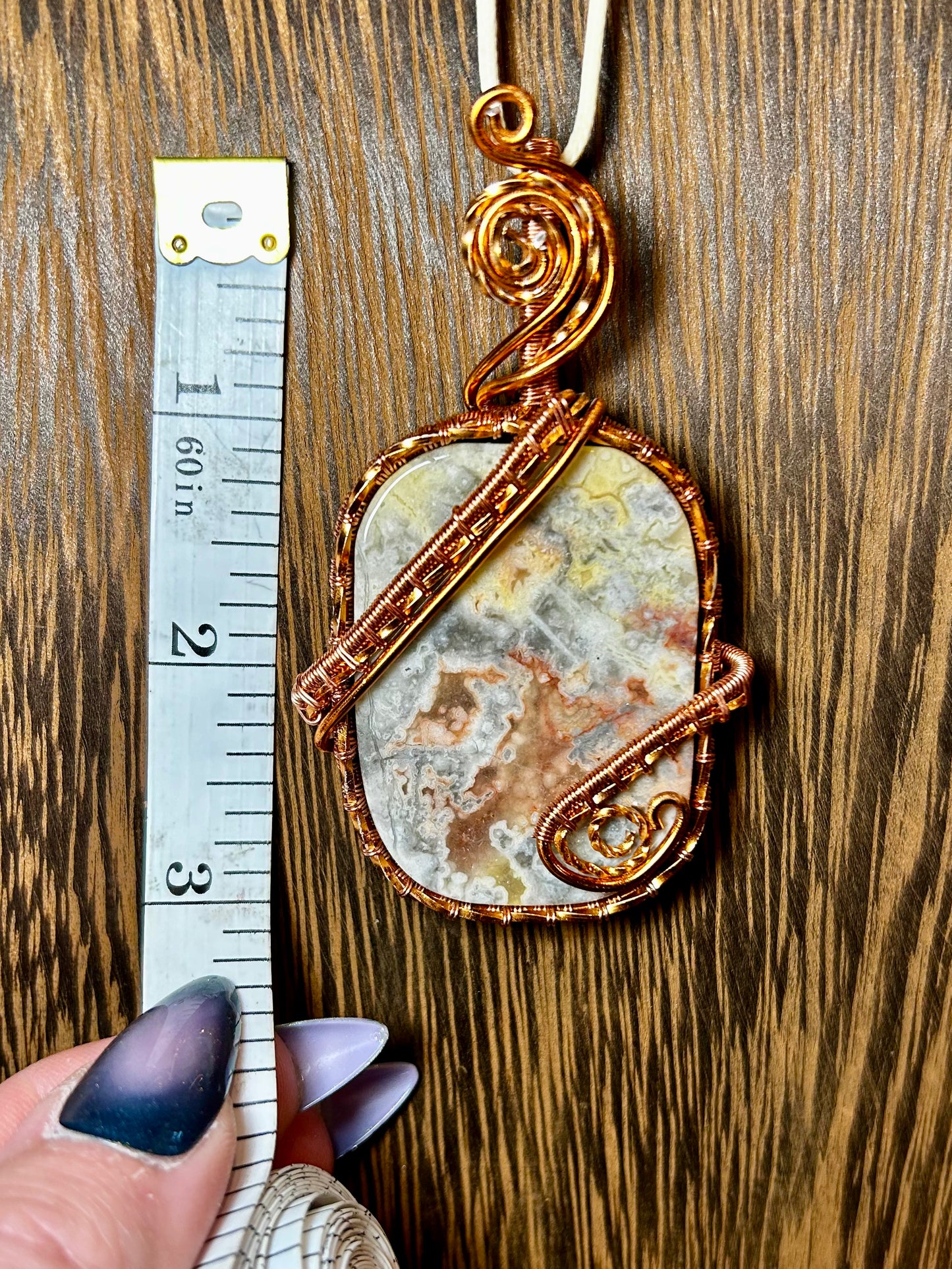 Crazy Lace Agate Wrapped In Copper Colored Wire