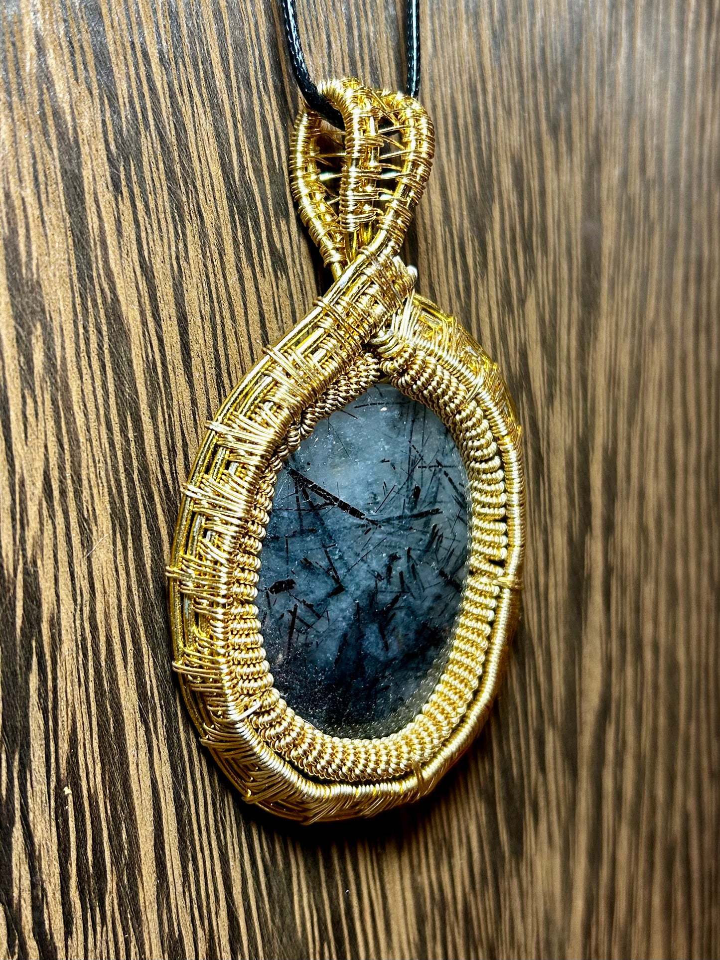 Tourmalated Quartz Wrapped In Gold Colored Wiring