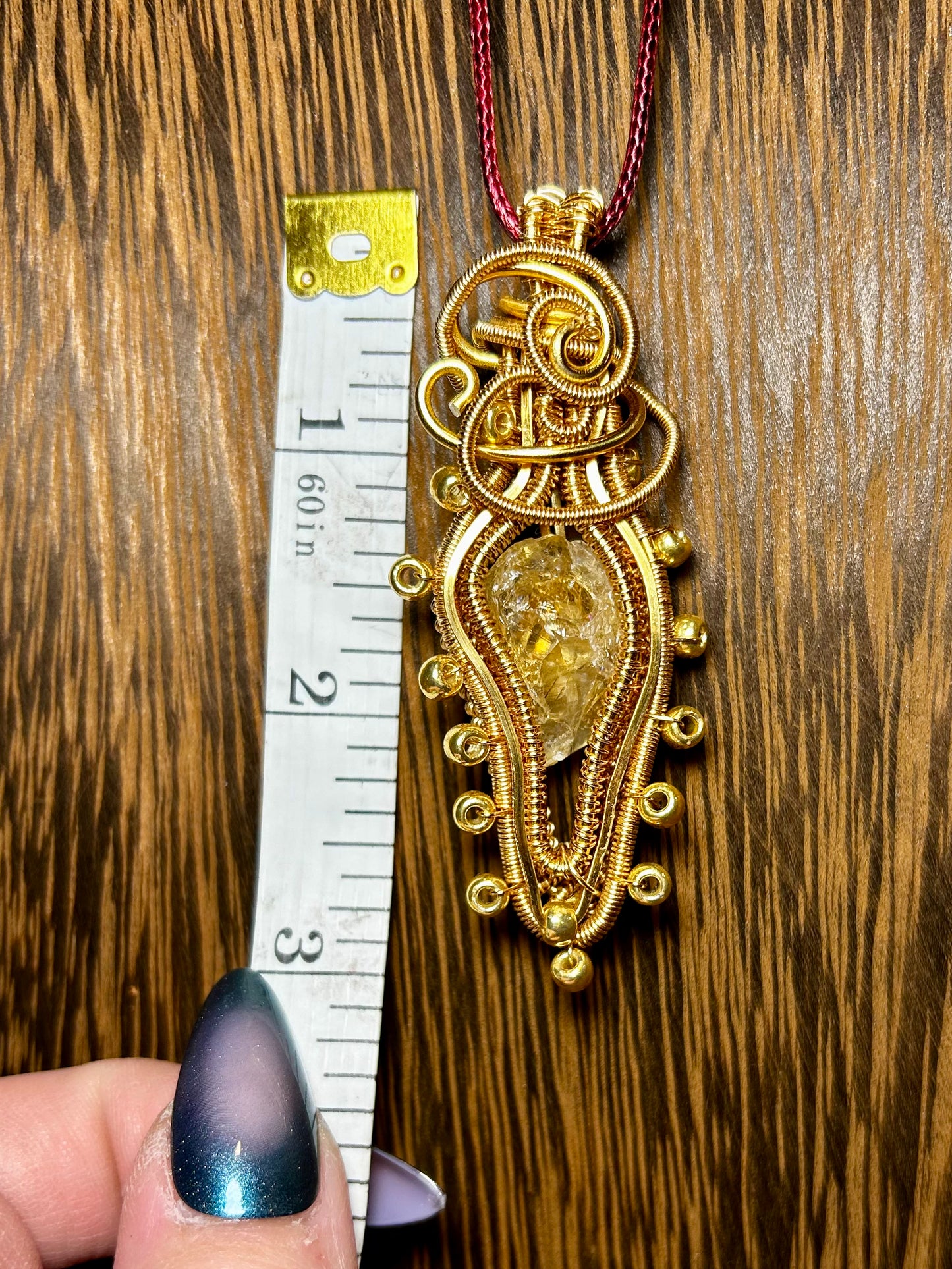 Citrine Wrapped in Gold Colored Wiring