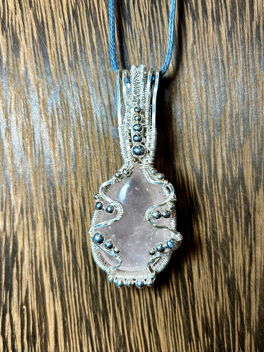 Rose Quartz Wrapped In Silver Colored Wiring