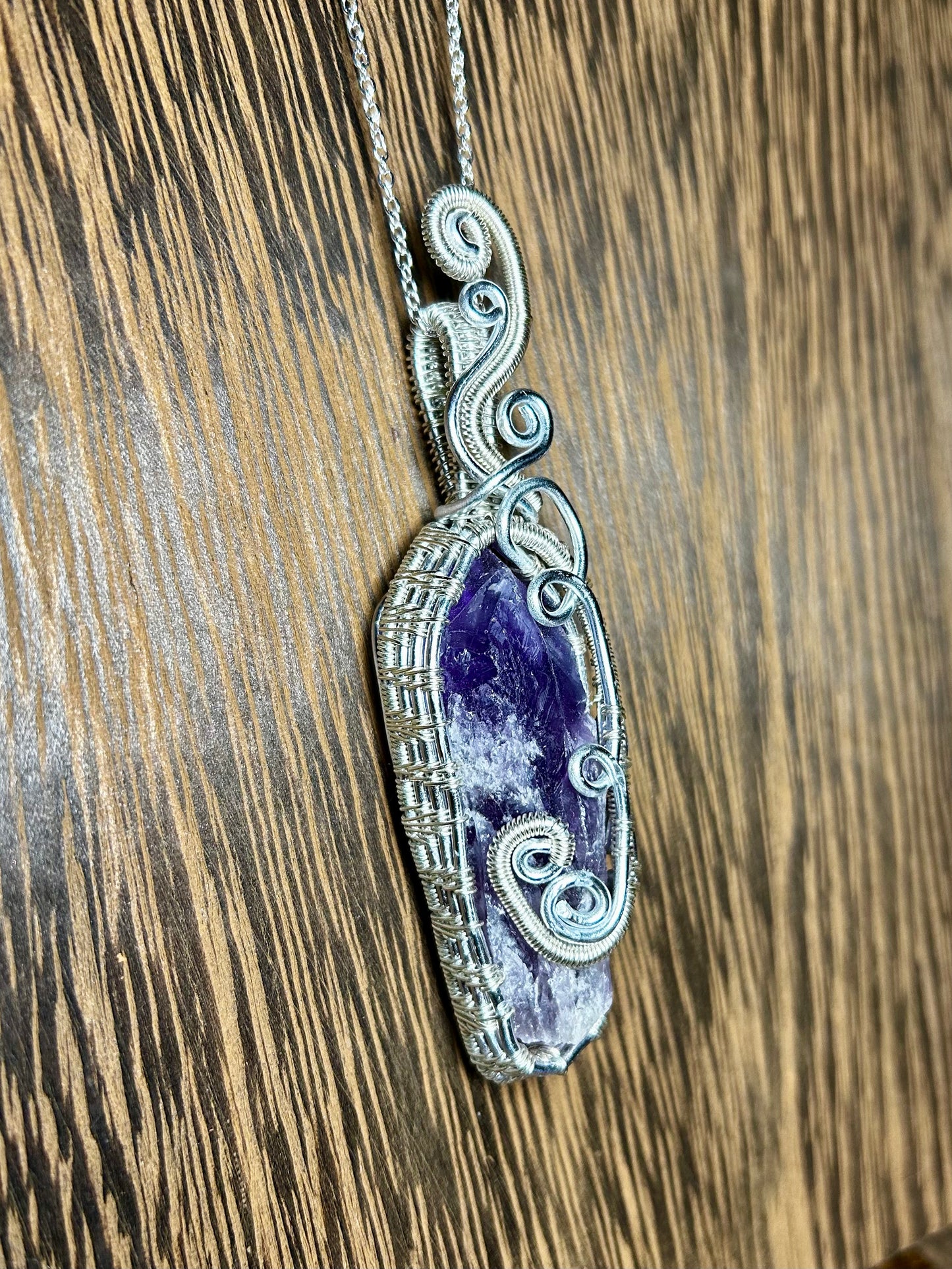 Bahia Amethyst Wrapped In Silver Colored Wiring