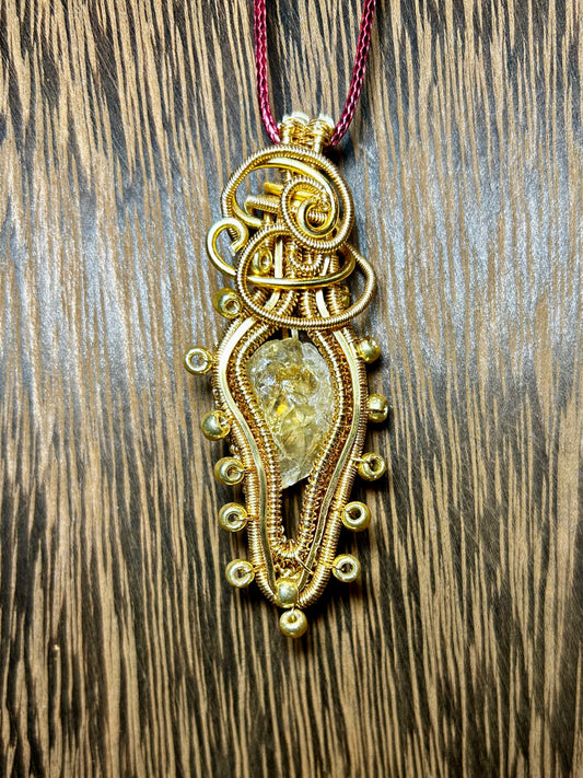 Citrine Wrapped in Gold Colored Wiring