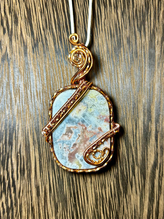 Crazy Lace Agate Wrapped In Copper Colored Wire