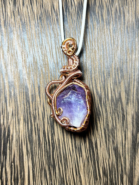 Amethyst Wrapped In Copper Colored Wiring