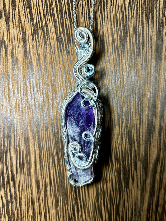 Bahia Amethyst Wrapped In Silver Colored Wiring